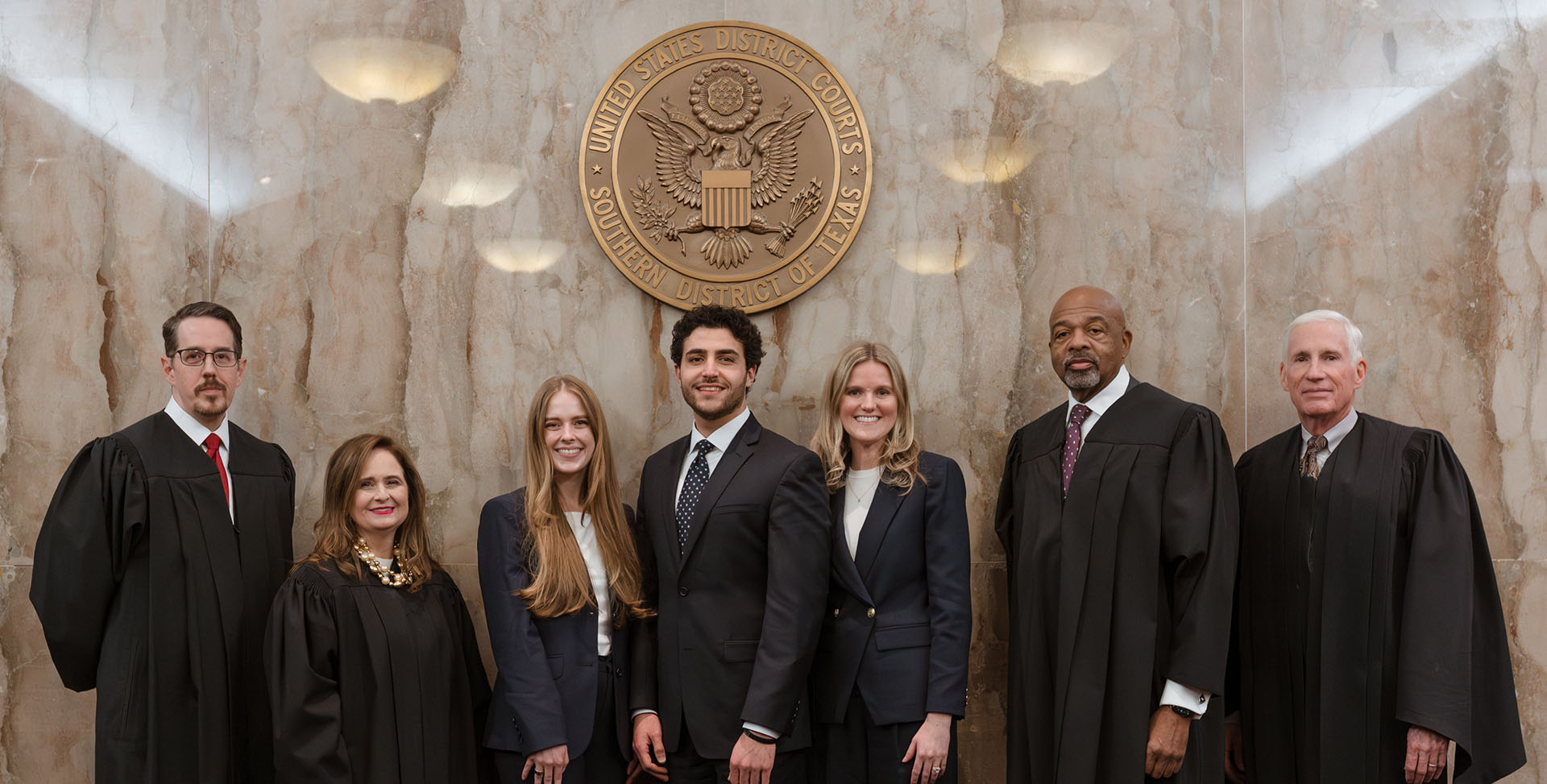Members of the winning Regent team with the competition judges (L to R): Jim Marrow (Problem Author and Partner, Wright Close Barger & Guzman); Hon. Jennifer Walker Elrod (Chief Judge, U.S. Court of Appeals for the Fifth Circuit); Regent University School of Law team members Diana Bloomquist, Eli El-Habr, Emily Mayers; Hon. James E. Graves, Jr. (U.S. Court of Appeals for the Fifth Circuit), Hon. Scott A. Brister (Chief Justice, Fifteenth Court of Appeals) 