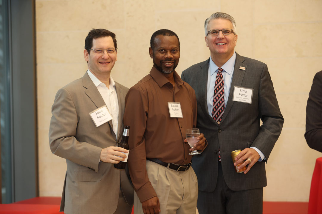 Jason Sander, Eustace Isidore, and Greg R. Vetter at the IPIL Advisory Council Dinner reception
