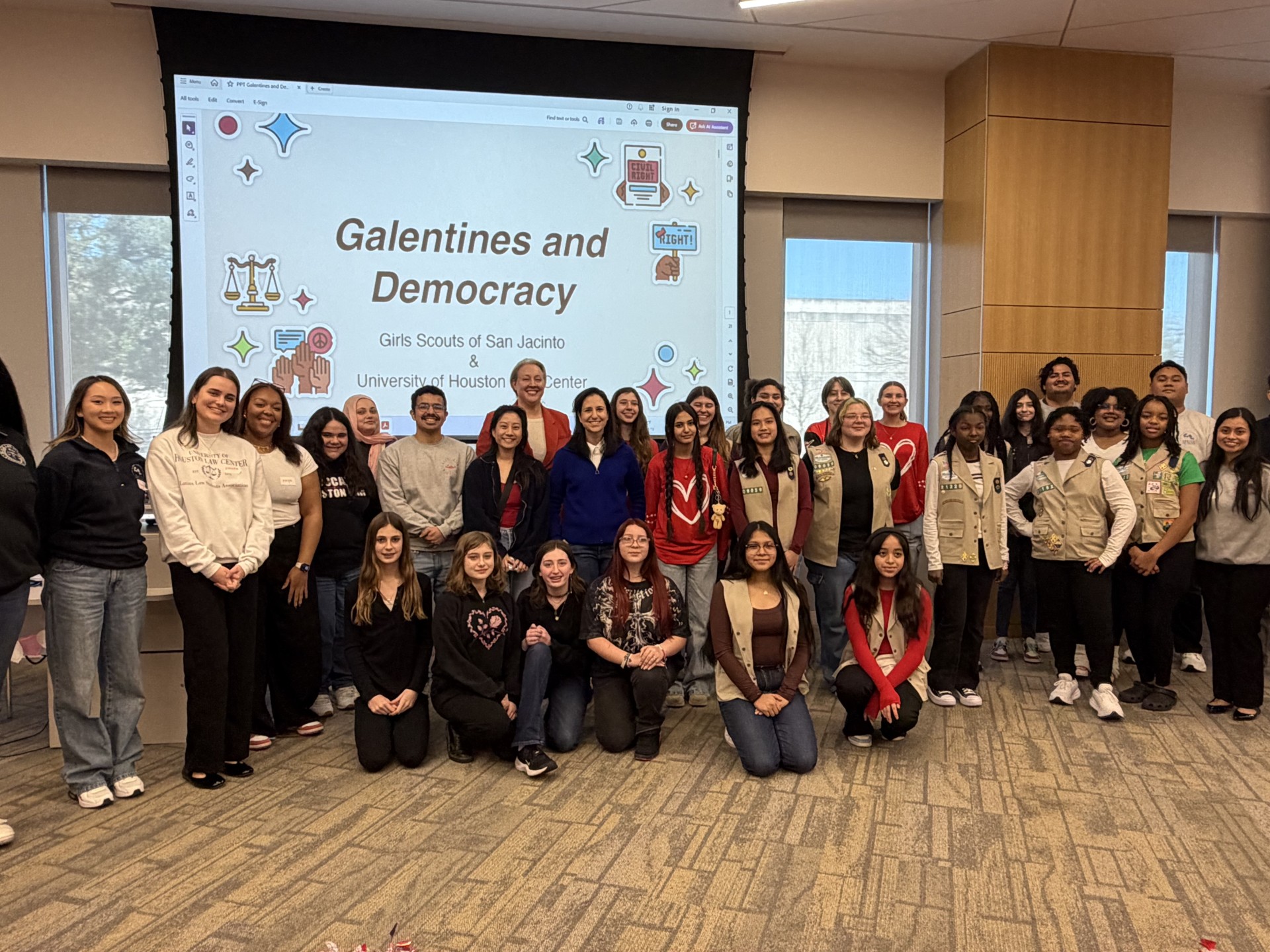 Galentine and Democracy Professor Hilary Reed (in red jacket, back center), and Houston City Council Member Alejandra Salinas (in front of Prof. Reed in blue blazer and white shirt) with the participants at UH Law's “Galentine’s & Democracy” event.