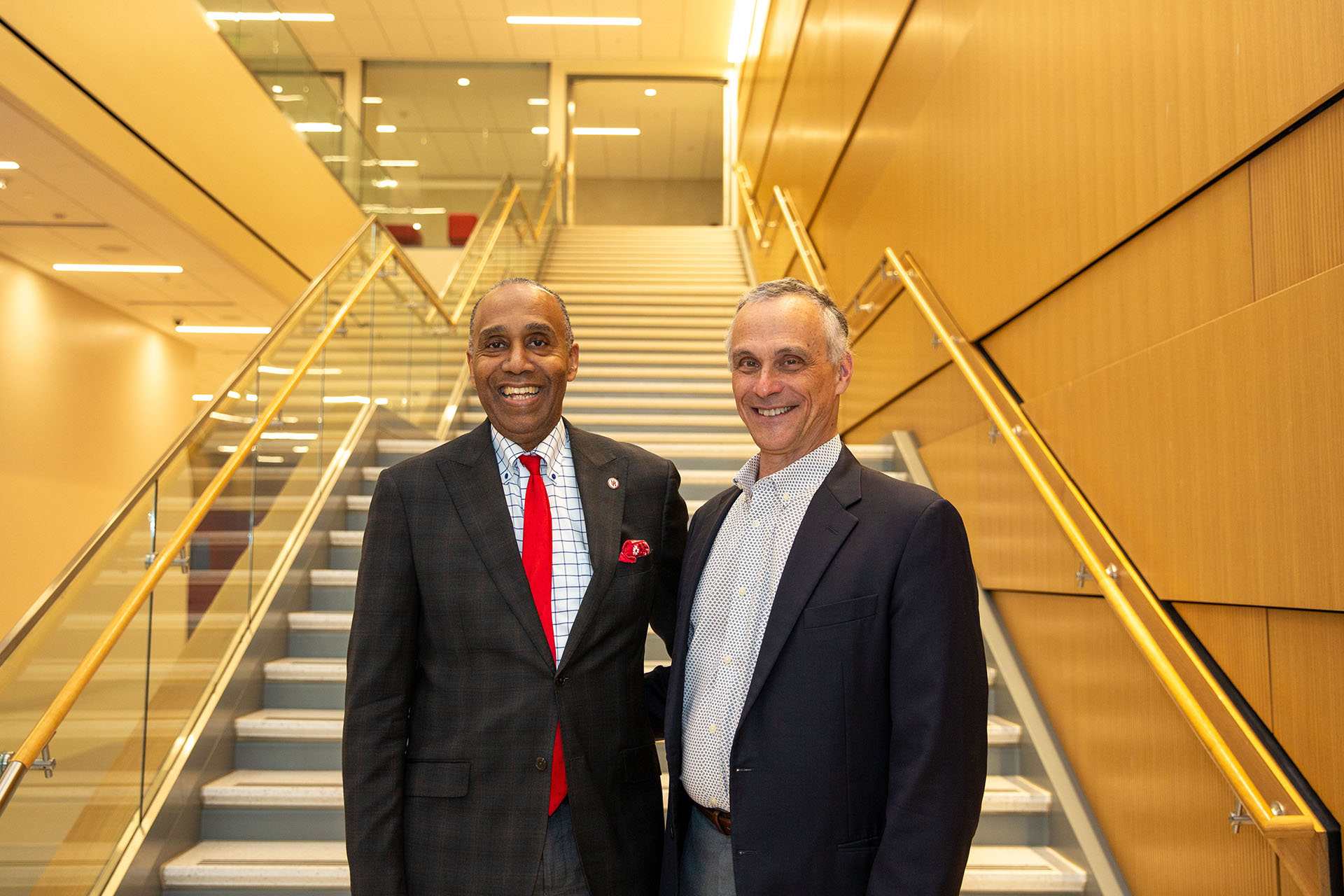UH Law Dean Leonard M. Baynes stands with Michael S. Roth inside the John M. O’Quinn Law Building on the University of Houston campus