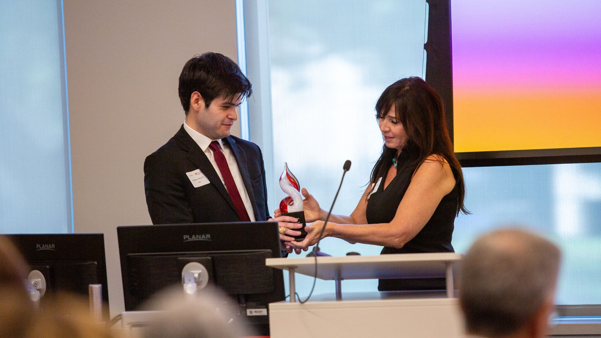 UH Law student Matthew Nieto receives the Susan L. Bickley Memorial Scholarship award from Gina S. Warren at the University of Houston Law Center.