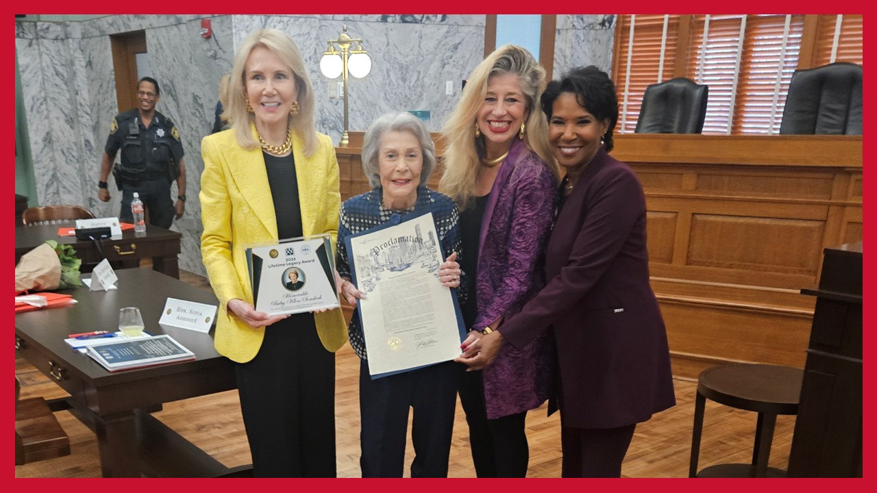 Justice Ruby Kless Sondock stands with UH Law Dean Leonard M. Baynes and another guest at the Law Center.